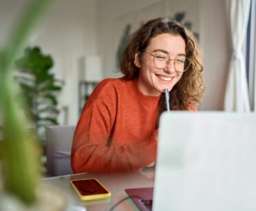 student looking at ncsu meal plan options on a laptop