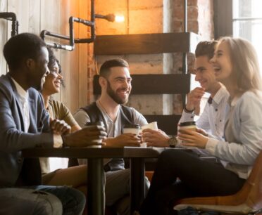 friends socializing at urban coffeehouse