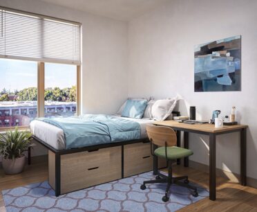 Rendering of furnished student bedroom with underbed storage and a desk